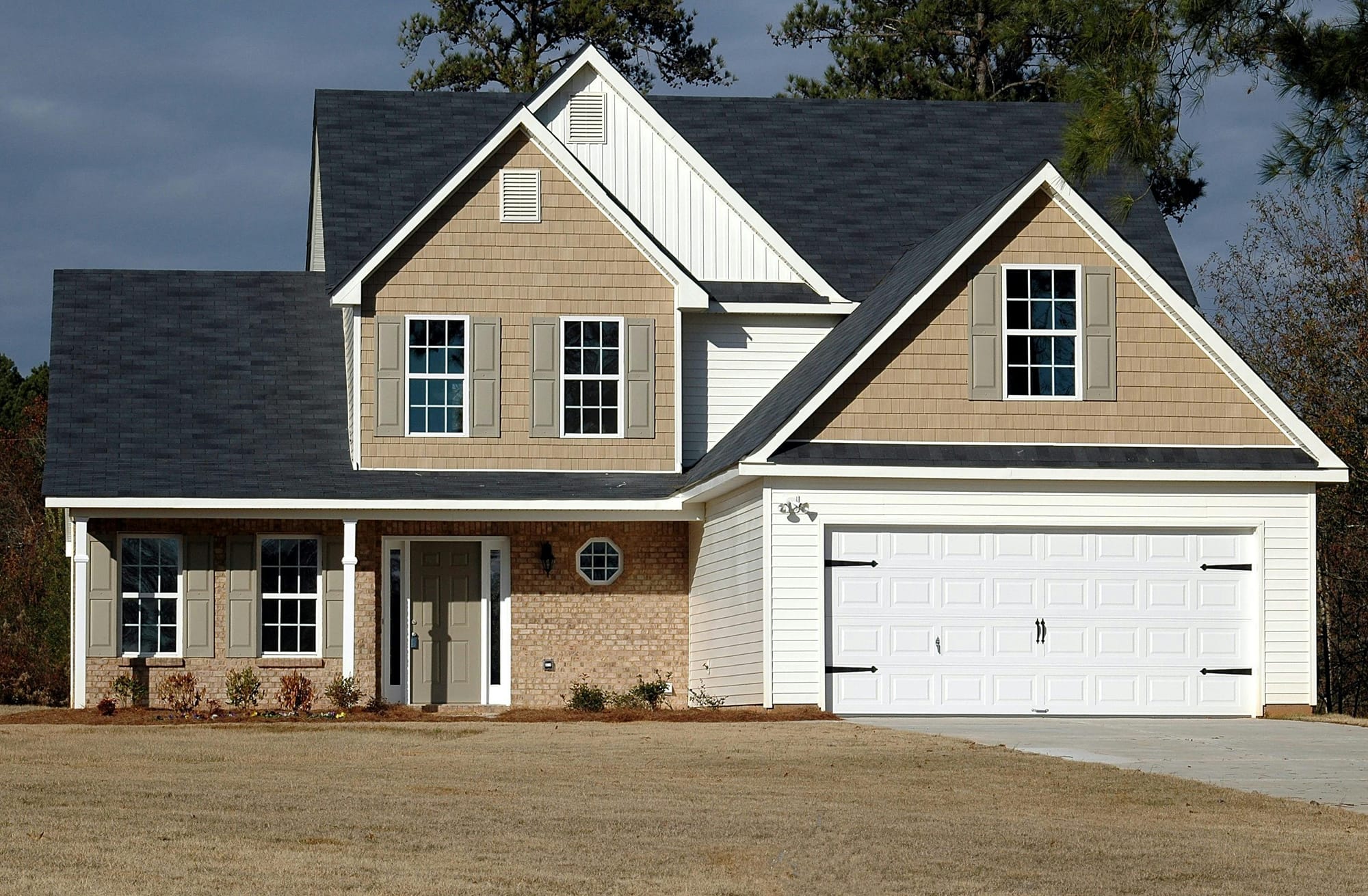 A newly installed garage door on a two-story Inland Empire home
