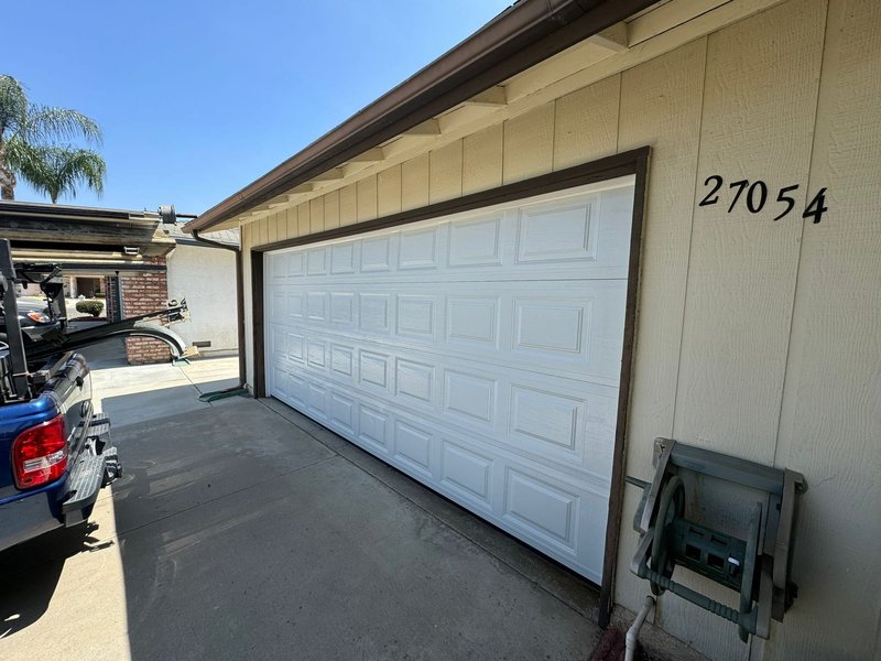 White Raised-Panel Sectional Garage Door Installation ,  24/7 Garage Door and Gate Services, Inland Empire CA