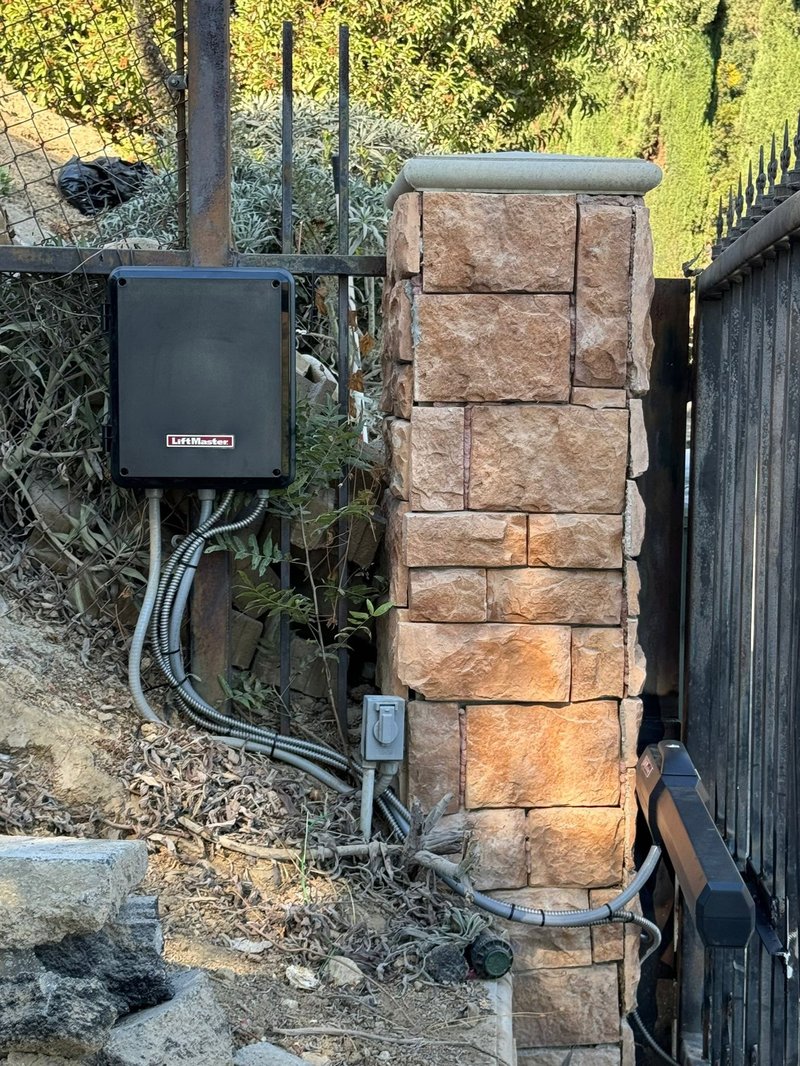 LiftMaster Gate Operator On Stone Pillar ,  24/7 Garage Door and Gate Services, Inland Empire CA