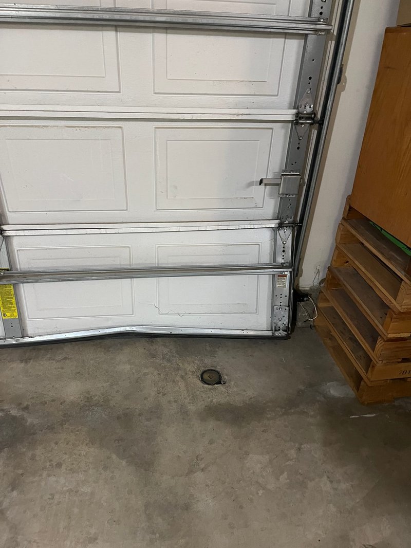 White Raised-Panel Sectional Garage Door Track Repair ,  24/7 Garage Door and Gate Services, Inland Empire CA
